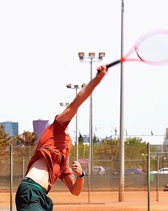 Pavel Viks making contact at full reach above his head
